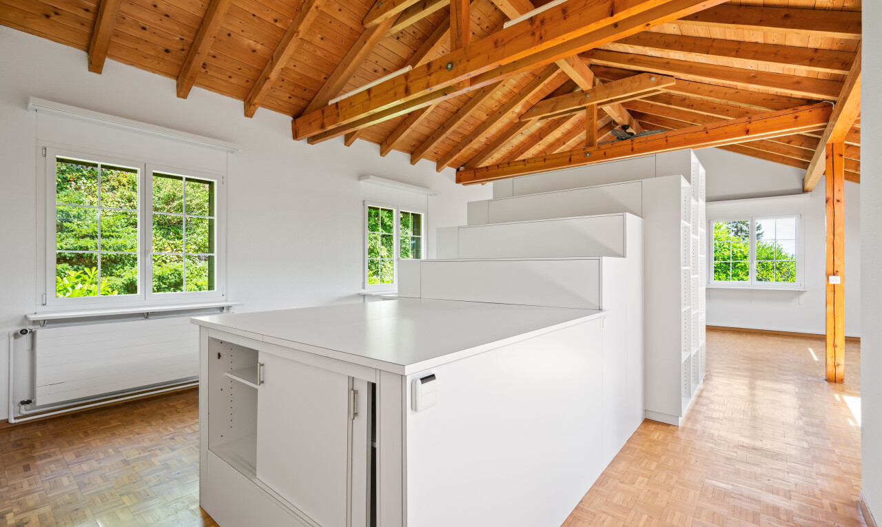 interior space with white cabinetry, light countertops, parquet floors, a wood ceiling with exposed beams, and a peninsula