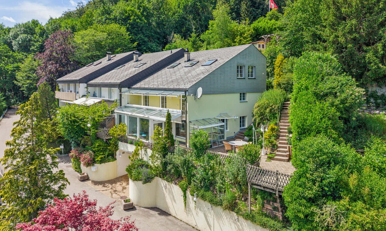 view of home with stairs and stucco siding