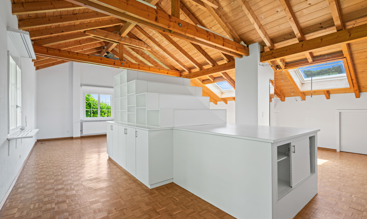 unfurnished room with parquet flooring, a wood ceiling with exposed beams, and a skylight