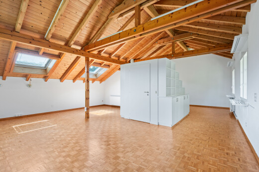 unfurnished room featuring parquet flooring, a skylight, and a wooden ceiling with exposed beams