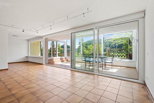 spare room featuring track lighting and light tile patterned floors