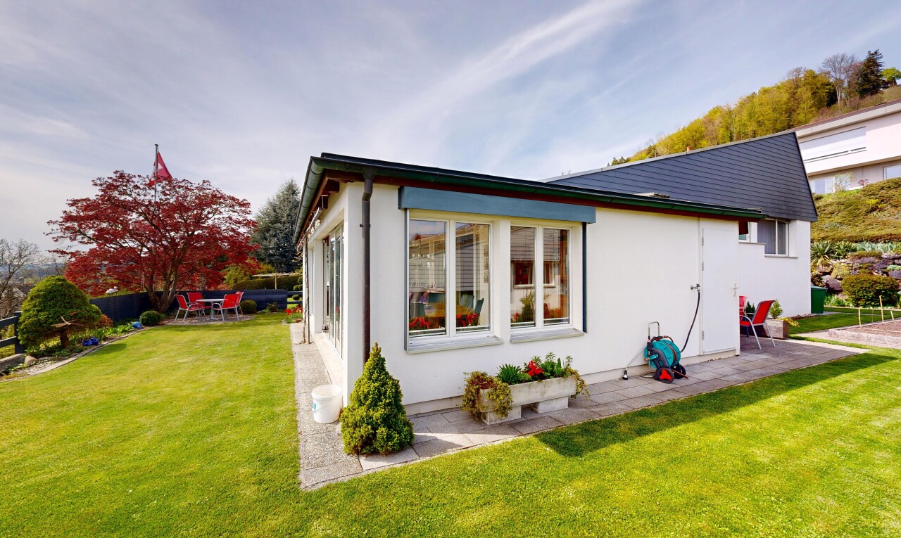 außenansicht mit from property, rasen, stuckverkleidung, terrasse, und day time