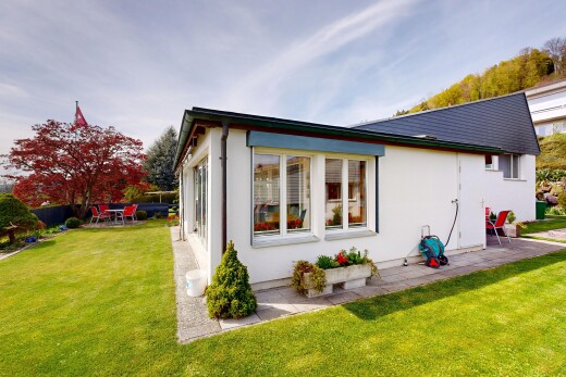 außenansicht mit from property, rasen, stuckverkleidung, terrasse, und day time