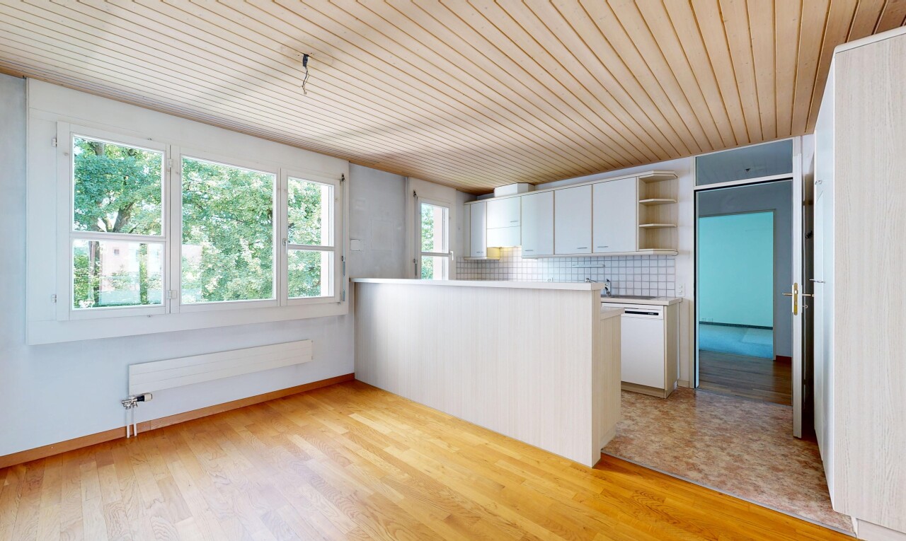 kitchen with a peninsula, light countertops, wood ceiling, decorative backsplash, and light wood-style flooring