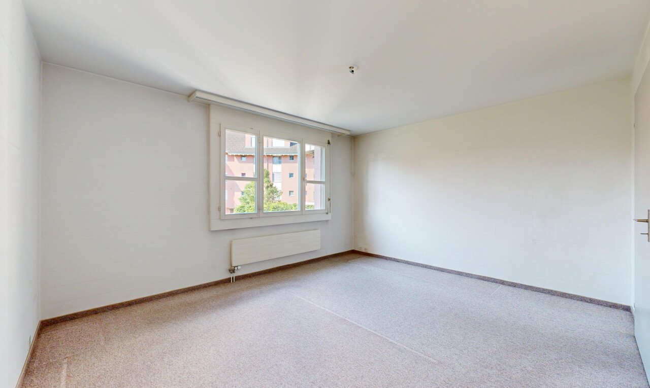 spare room with carpet and radiator heating unit