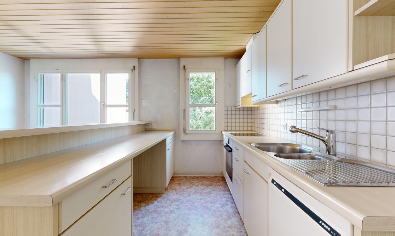 kitchen with light countertops, white dishwasher, white cabinets, wooden ceiling, and light flooring