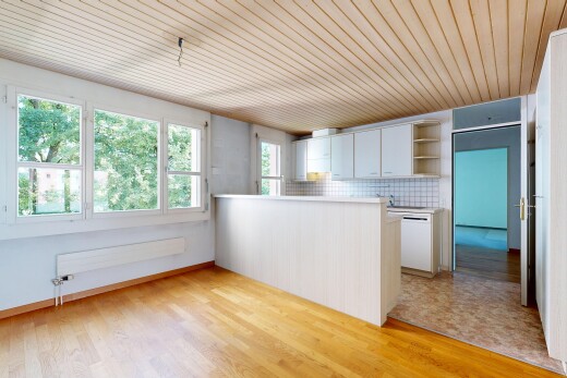 kitchen with a peninsula, light countertops, wood ceiling, decorative backsplash, and light wood-style flooring