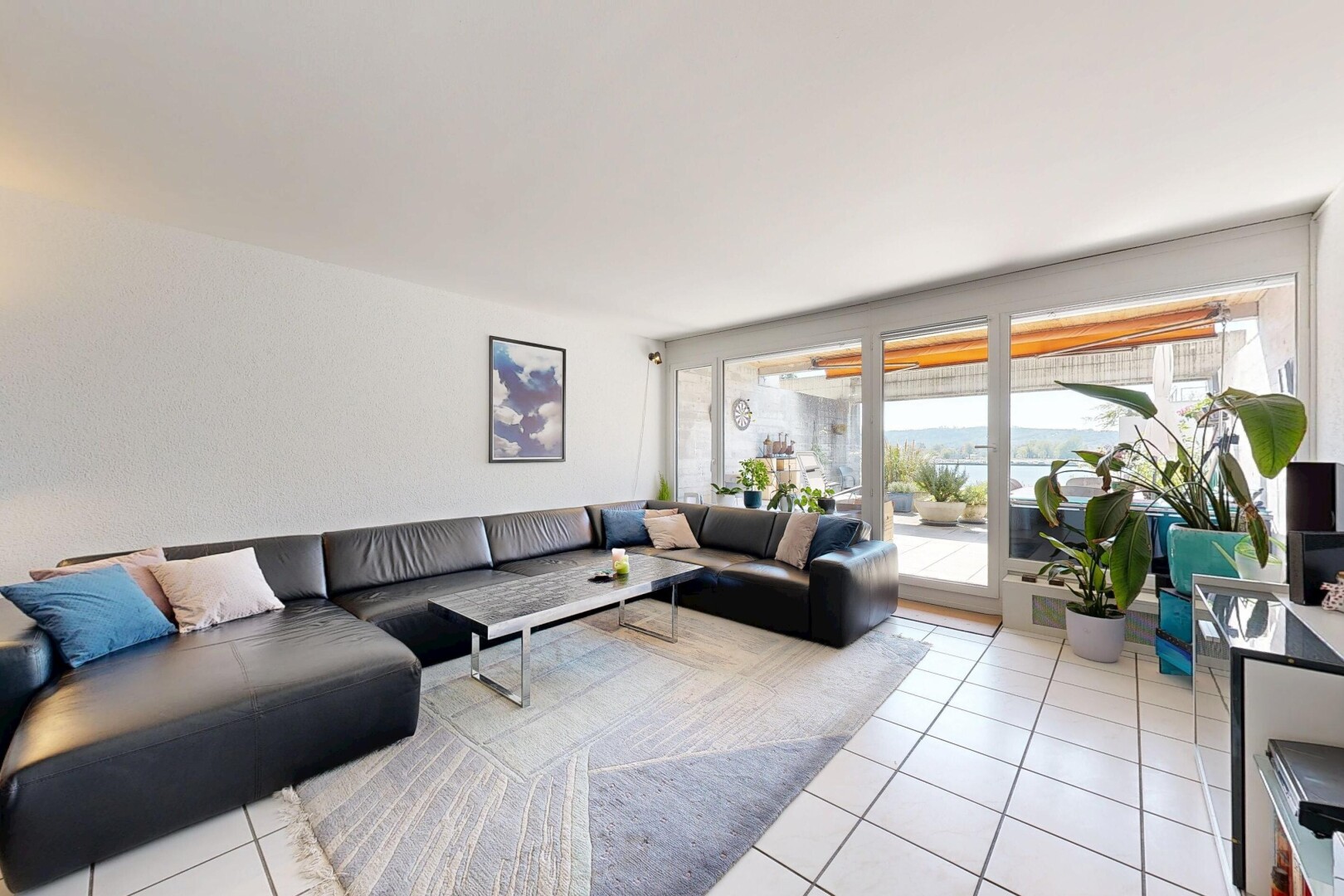 living room with light tile patterned floors