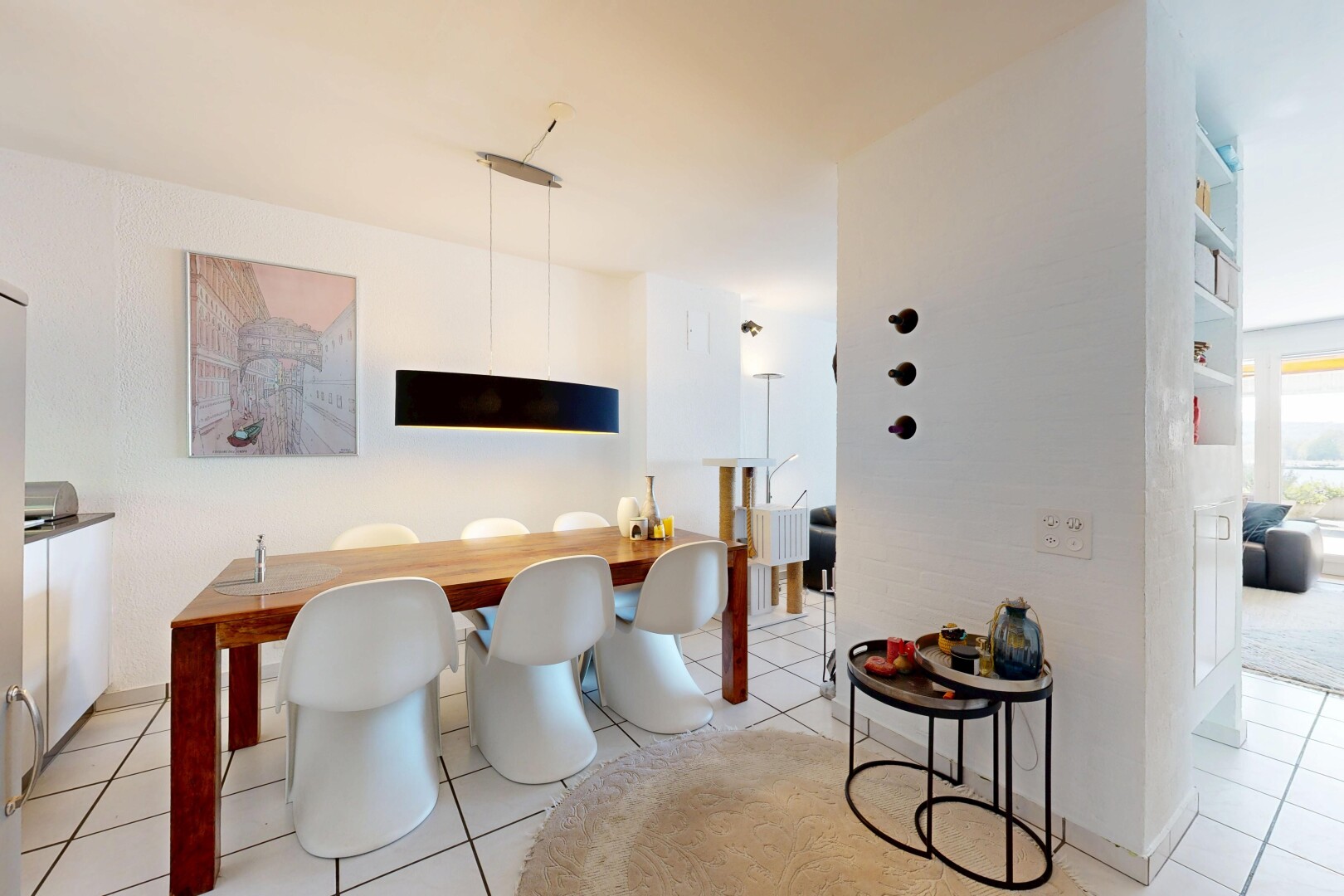 dining space featuring light tile patterned flooring