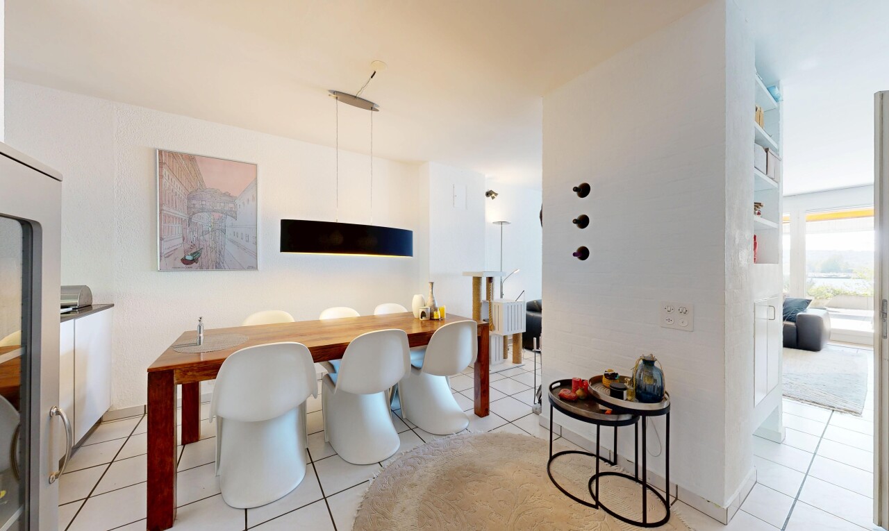 dining space featuring light tile patterned flooring