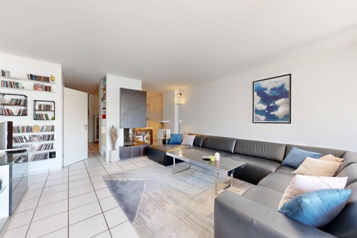 living area featuring light tile patterned flooring