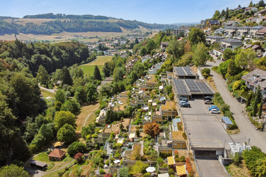 view of mountain backdrop featuring nearby suburban area