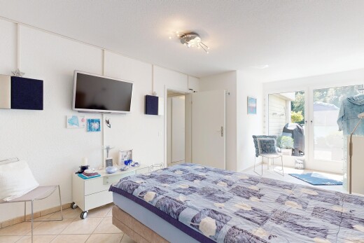 room with light tile patterned floors and access to exterior
