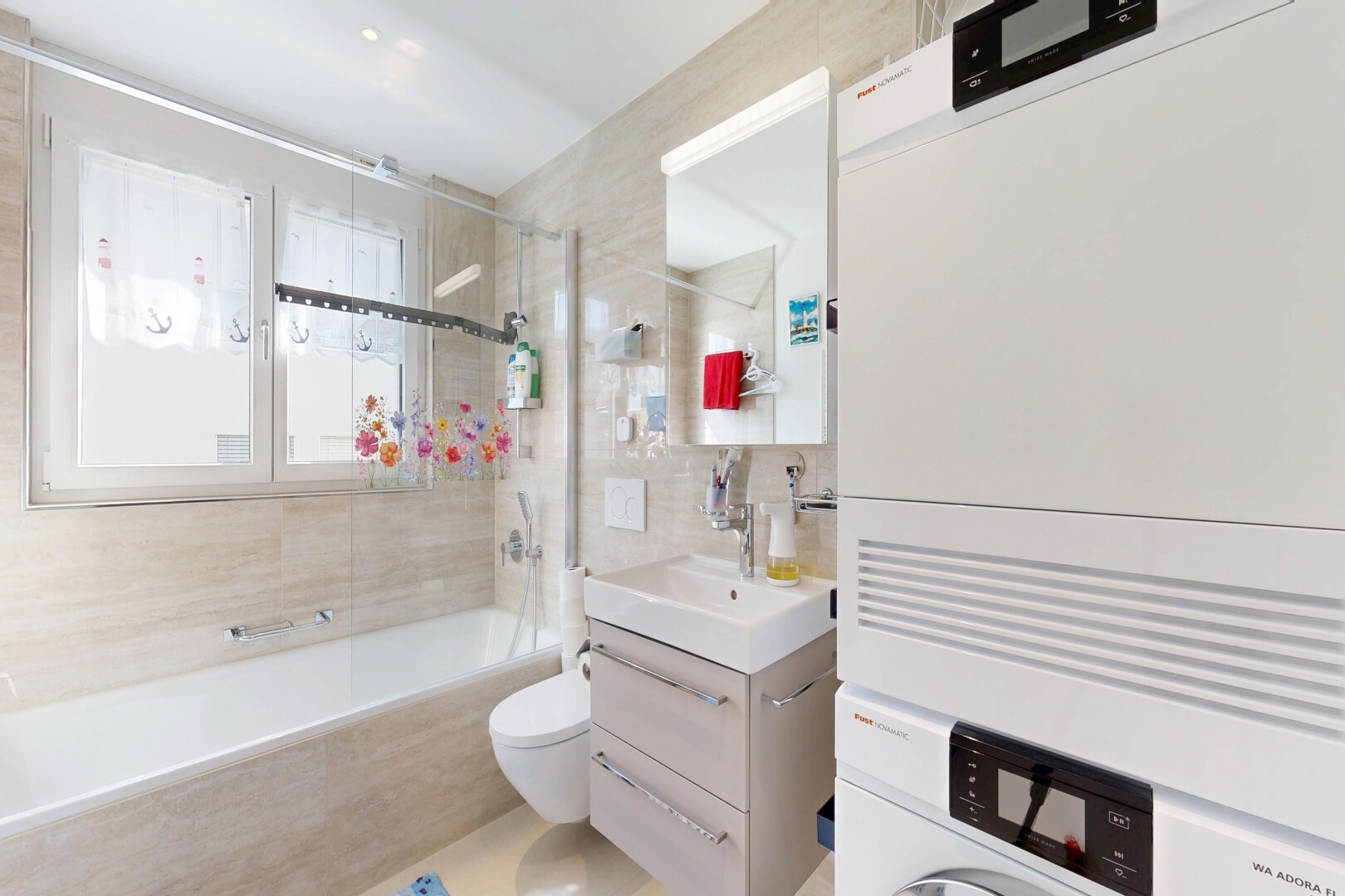 full bathroom featuring vanity, tile walls, and tiled shower / bath combo