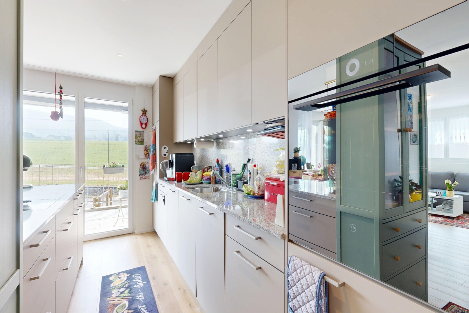 kitchen with light wood-style floors, white cabinets, and healthy amount of natural light