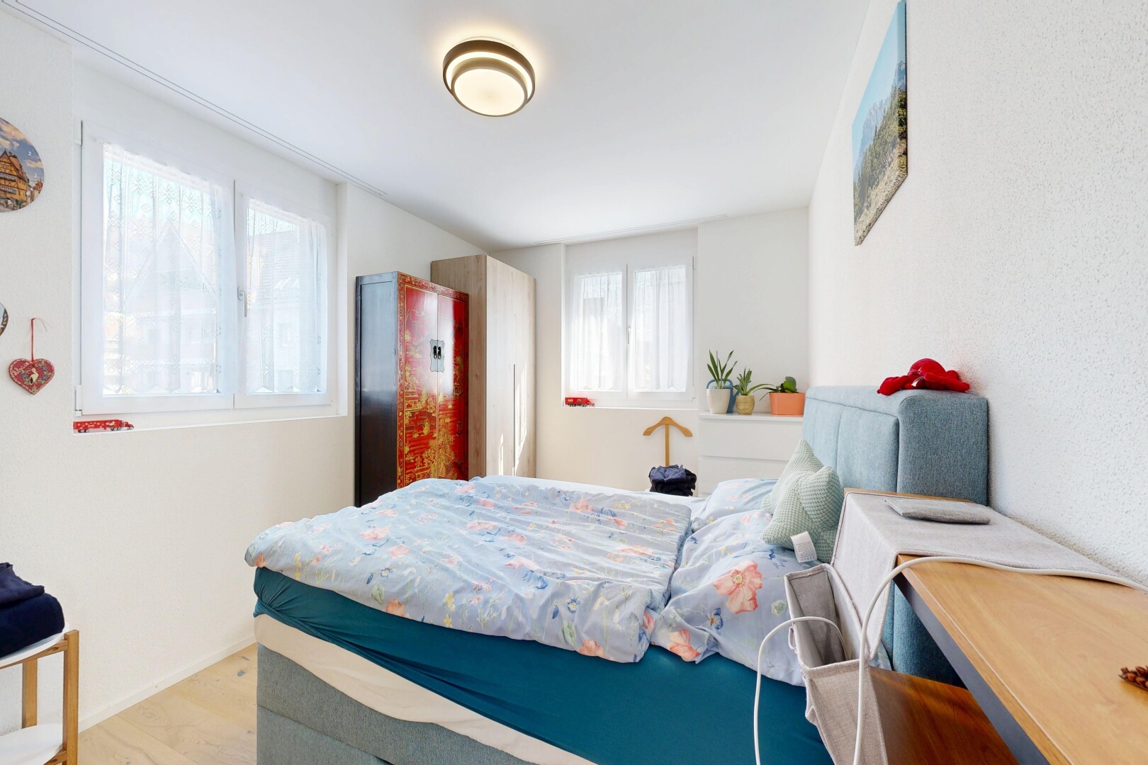 room / bedroom featuring light wood-type flooring and baseboards