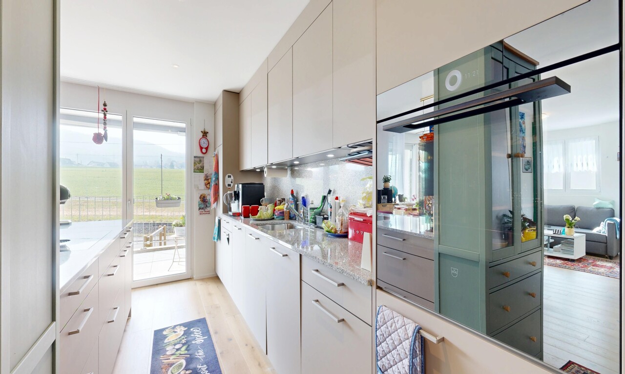 kitchen with light wood-style floors, white cabinets, and healthy amount of natural light