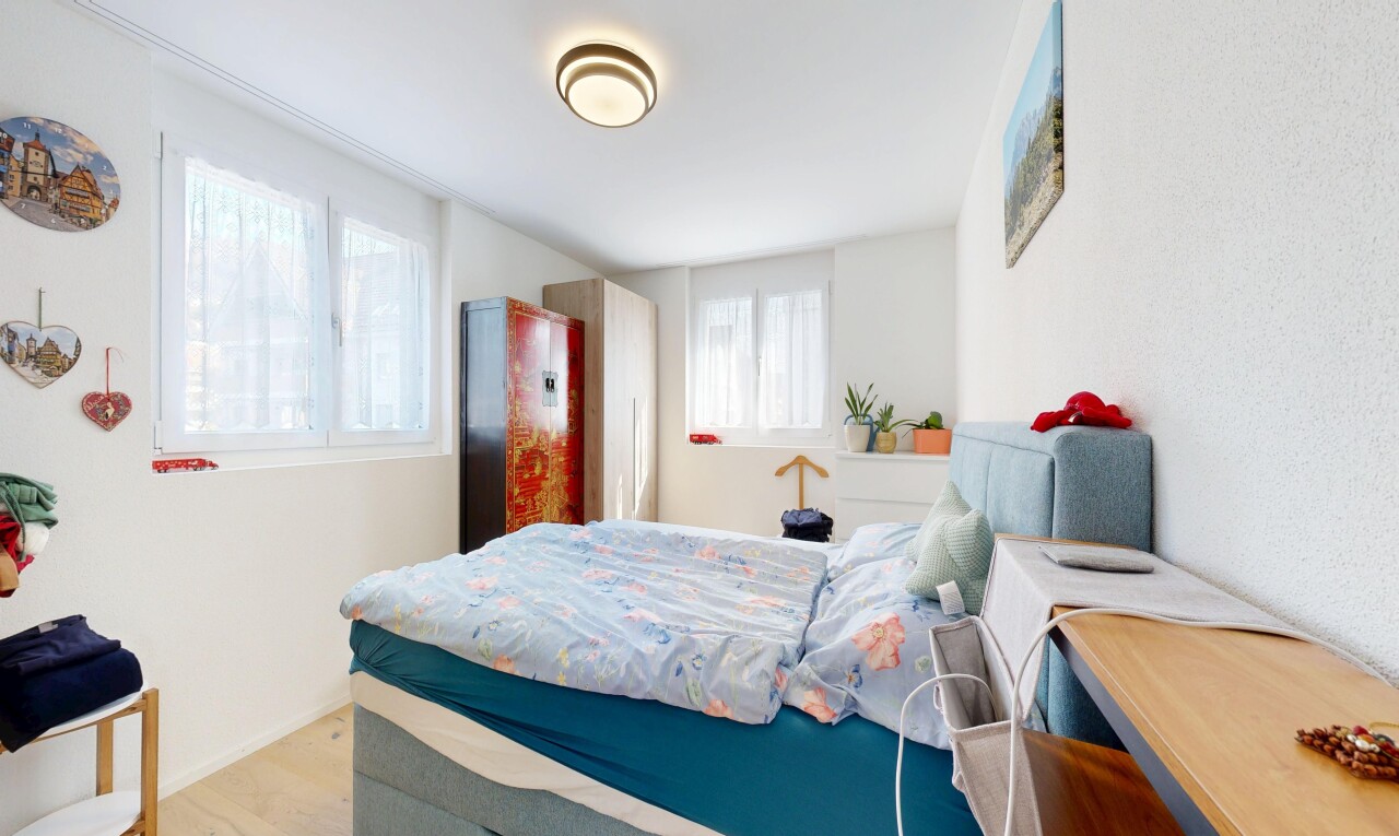 room / bedroom featuring light wood-type flooring and baseboards