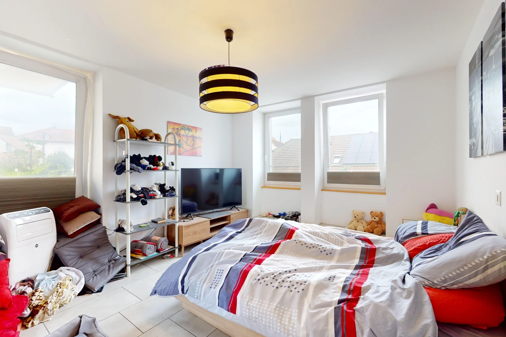 room / bedroom with light tile patterned floors