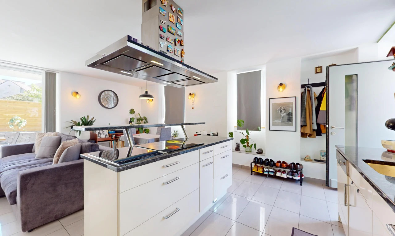 kitchen featuring white cabinets, island exhaust hood, pendant lighting, and light tile patterned floors