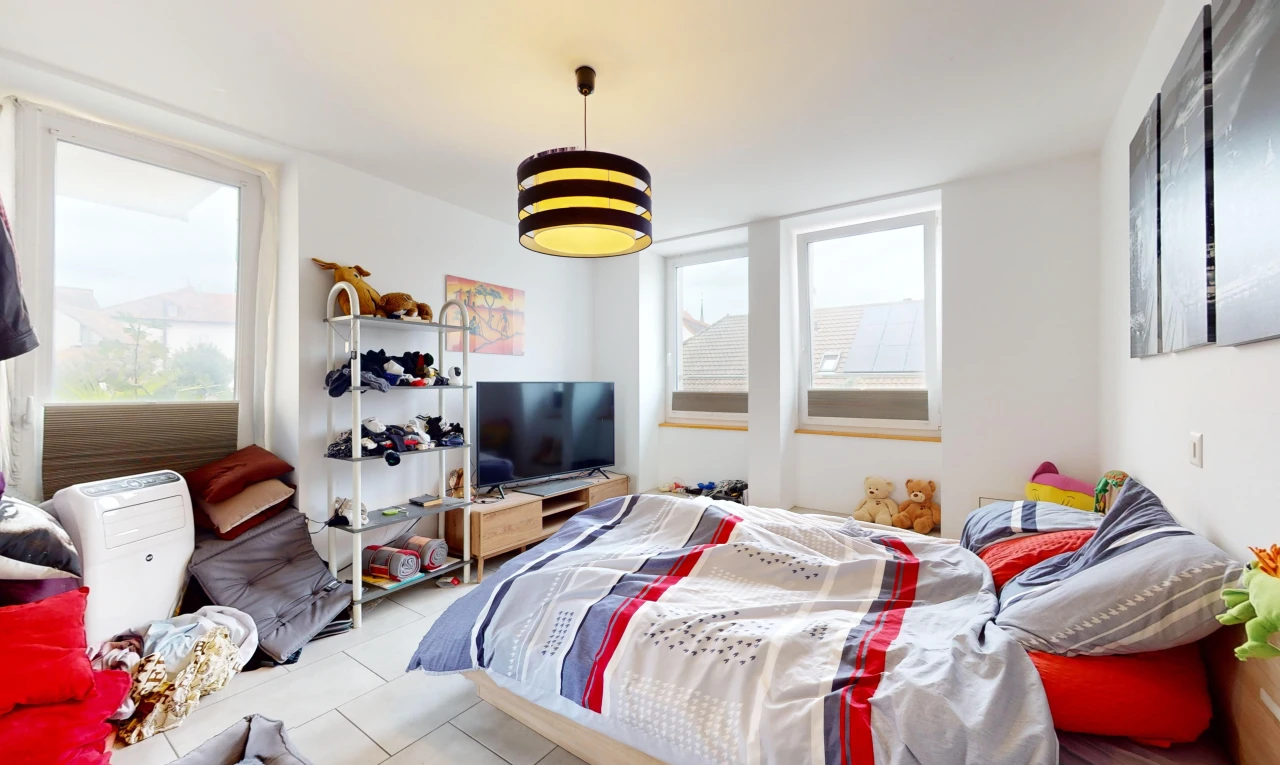 room / bedroom with light tile patterned floors