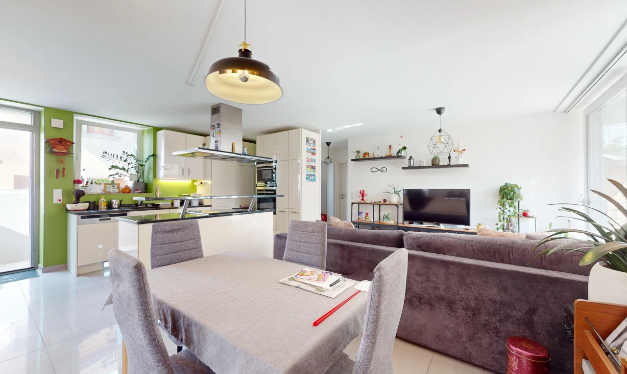 living / dining room with light tile patterned floors