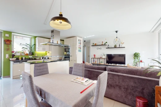 living / dining room with light tile patterned floors