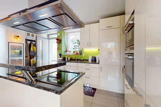 kitchen with white cabinetry, stainless steel oven, light tile patterned floors, and extractor fan