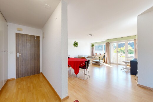 couloir avec accès à l'extérieur, drywall, cloison sèche, wood finish floor, et sol en finition bois