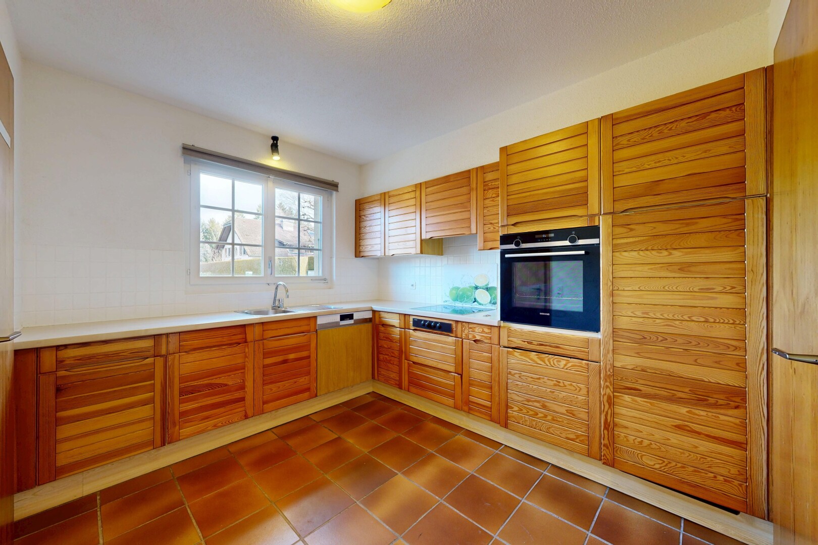 küche mit arbeitsplatten, light countertops, ofen, inside property, und natural light