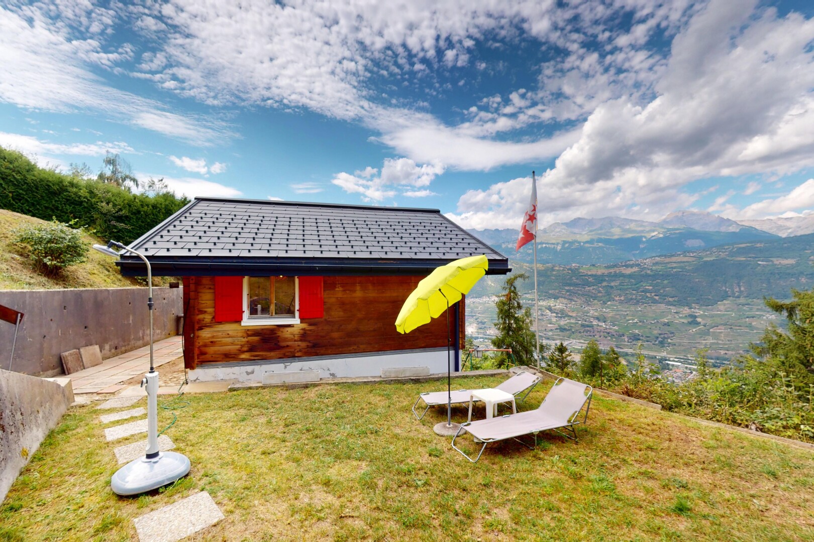 view of property with a mountain view and a yard