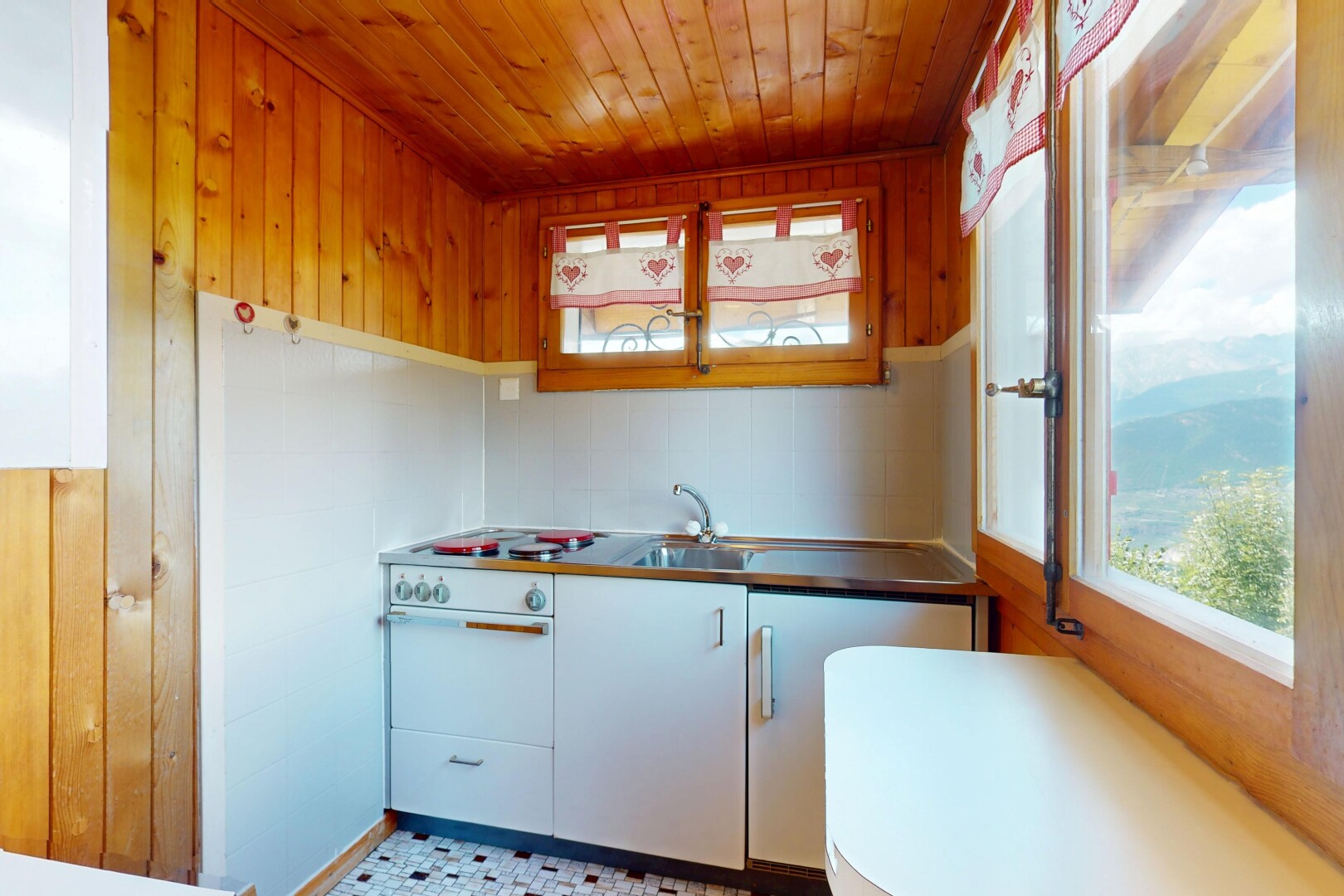 kitchen with wooden walls and wooden ceiling