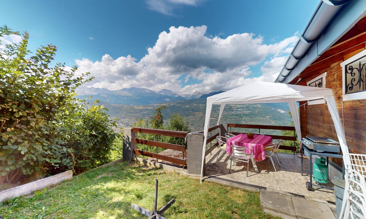 garden featuring a gazebo, a mountain view, a yard, and a grill