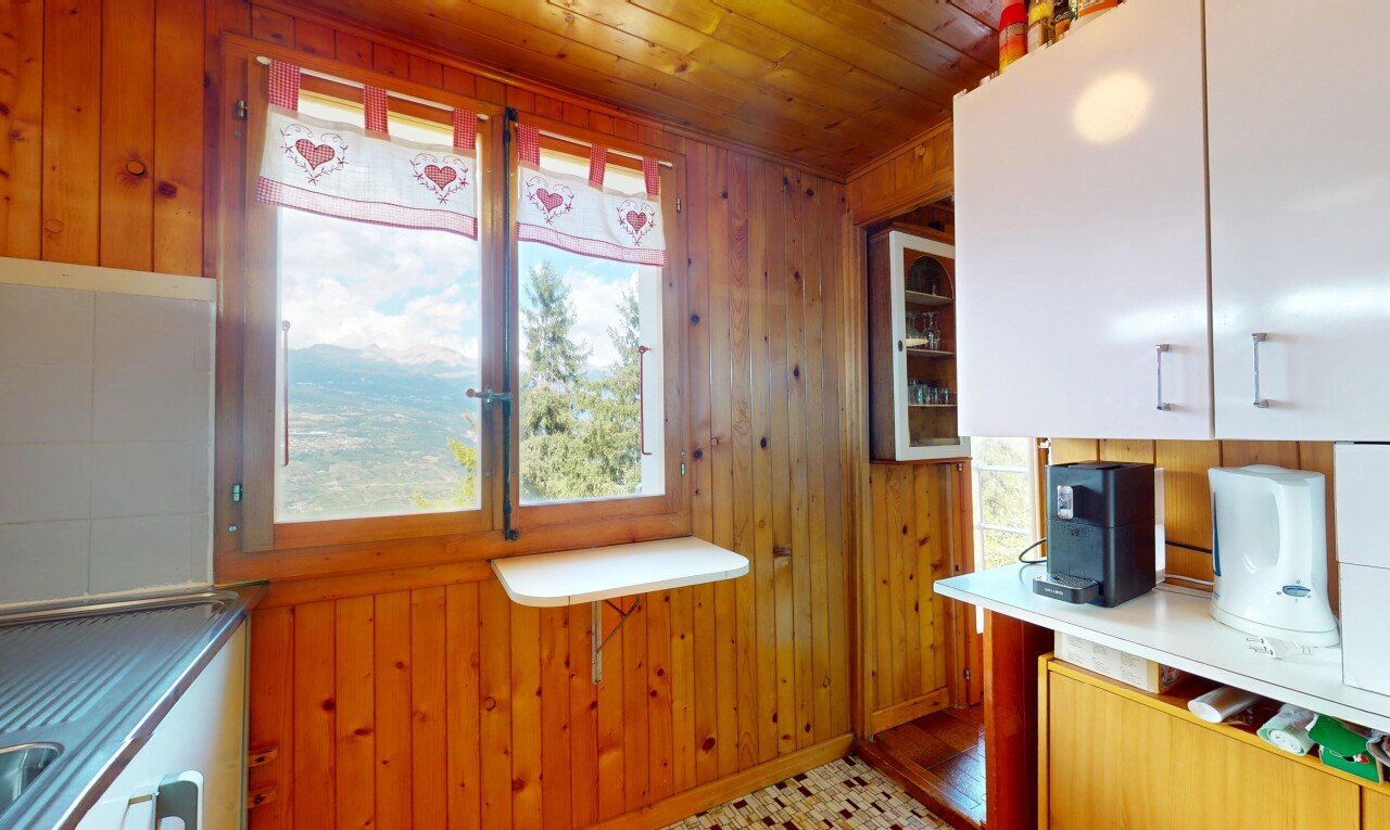 kitchen with wood walls and wood ceiling