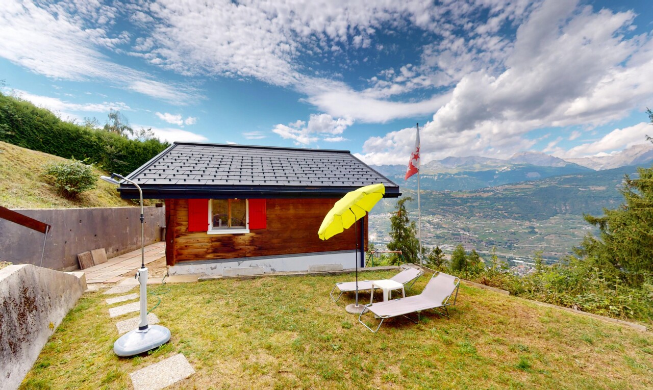 view of property with a mountain view and a yard