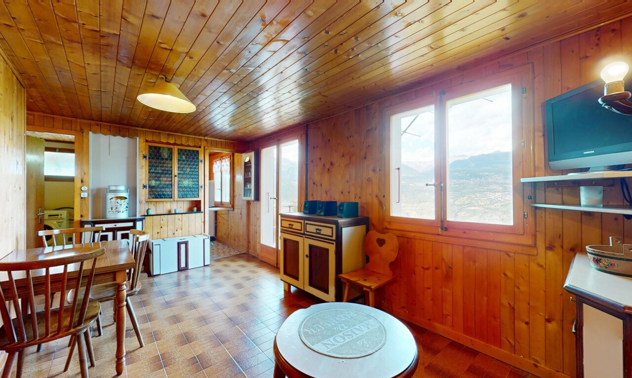 dining room featuring wooden walls, plenty of natural light, wood ceiling, and tile patterned floors