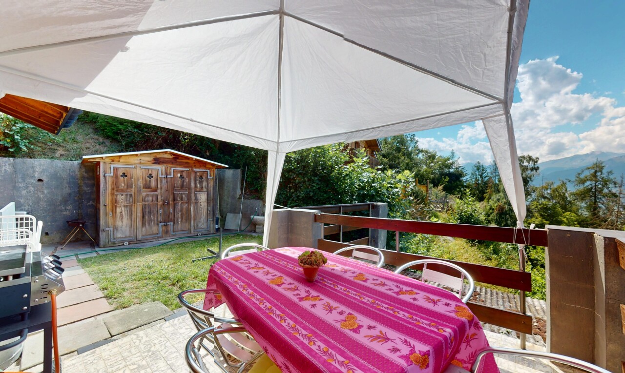patio / terrace featuring a storage shed, outdoor dining space, and area for grilling