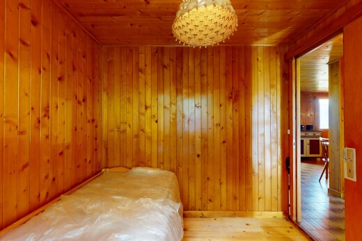 unfurnished room with hardwood / wood-style floors, wood ceiling, and wooden walls