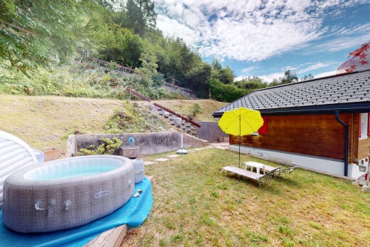 garden with a lawn and a hot tub