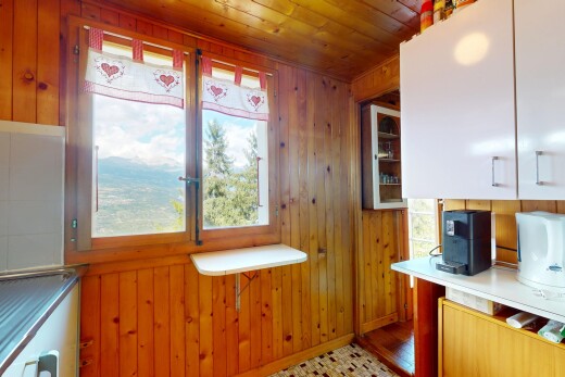 kitchen with wood walls and wood ceiling