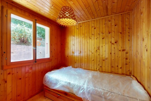 room / bedroom featuring wood walls and wooden ceiling