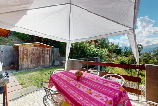 patio / terrace featuring a storage shed, outdoor dining space, and area for grilling