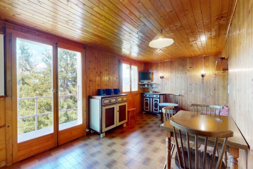 dining area with wood walls, wooden ceiling, and tile patterned floors