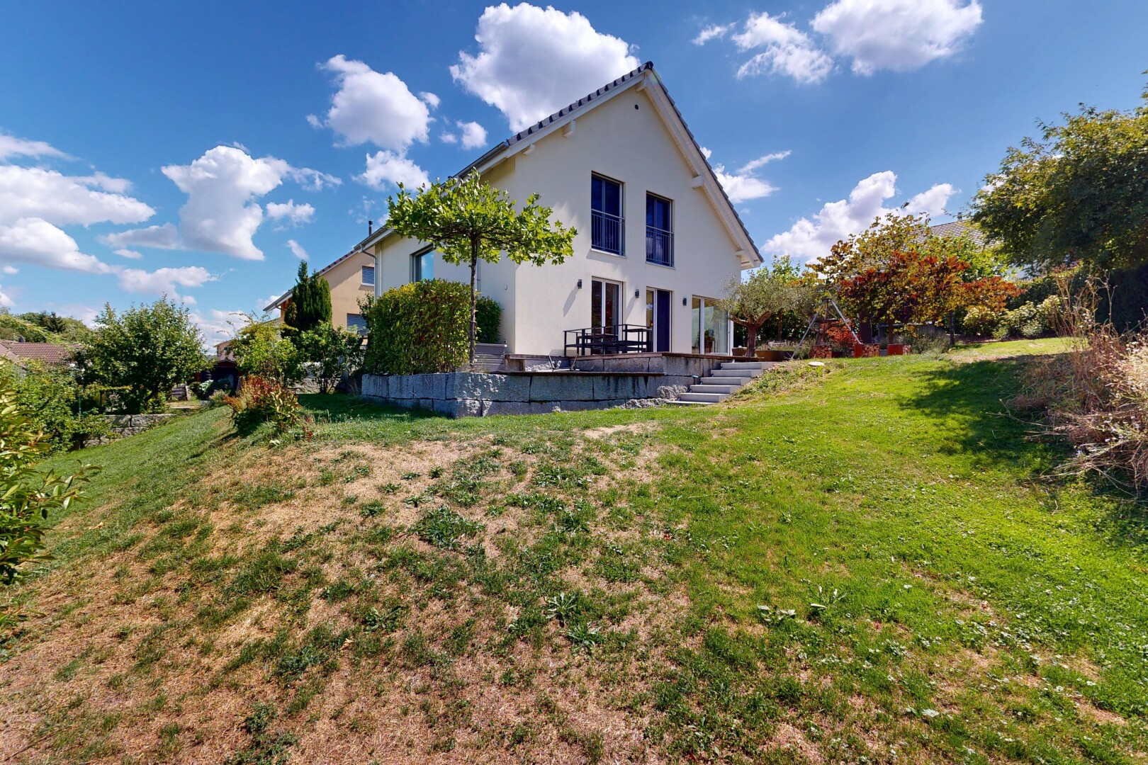 view of property with a yard and stucco siding