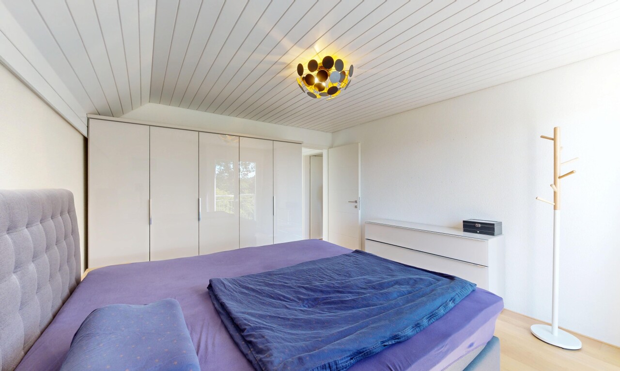 room / bedroom featuring a closet, wooden ceiling, and light wood-type flooring