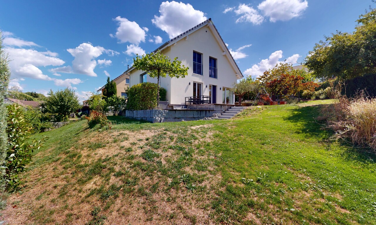 view of property with a yard and stucco siding