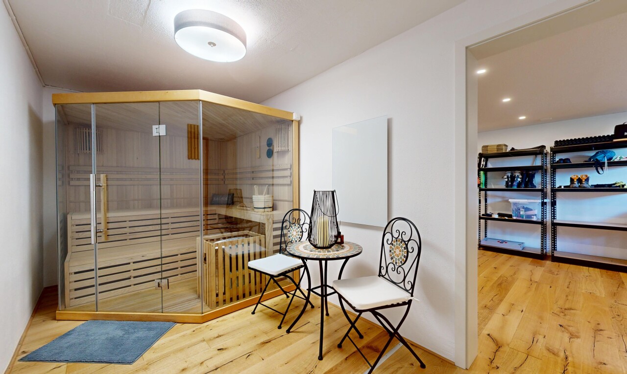 dining room with a sauna / steam room and light wood-style floors