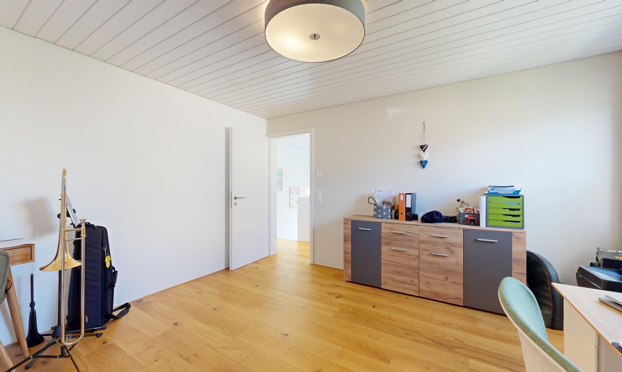 home office featuring light wood finished floors and wooden ceiling