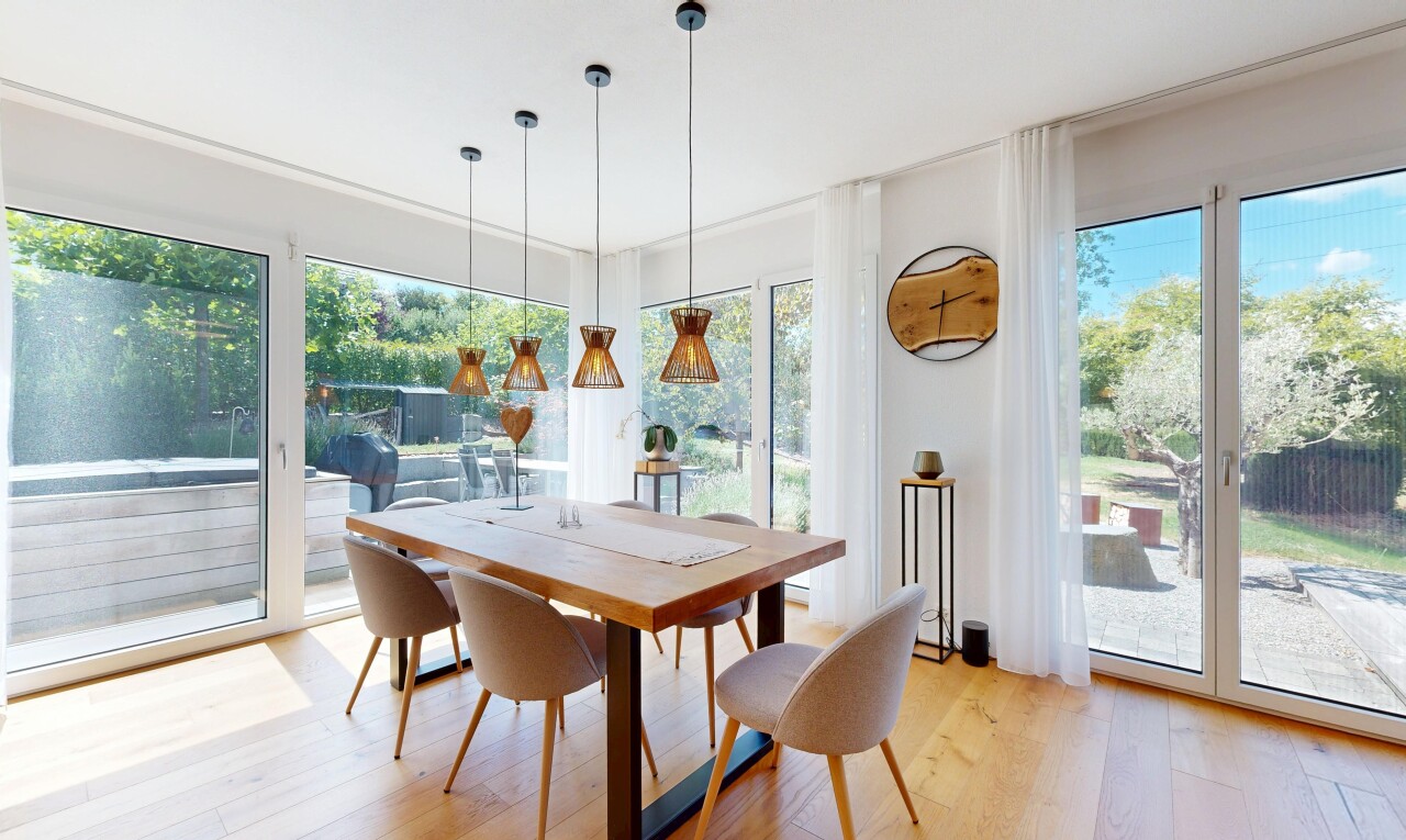 dining area featuring hanging light fixtures and light wood-style floors