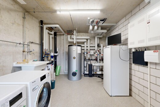 laundry area with water heater and washer and clothes dryer